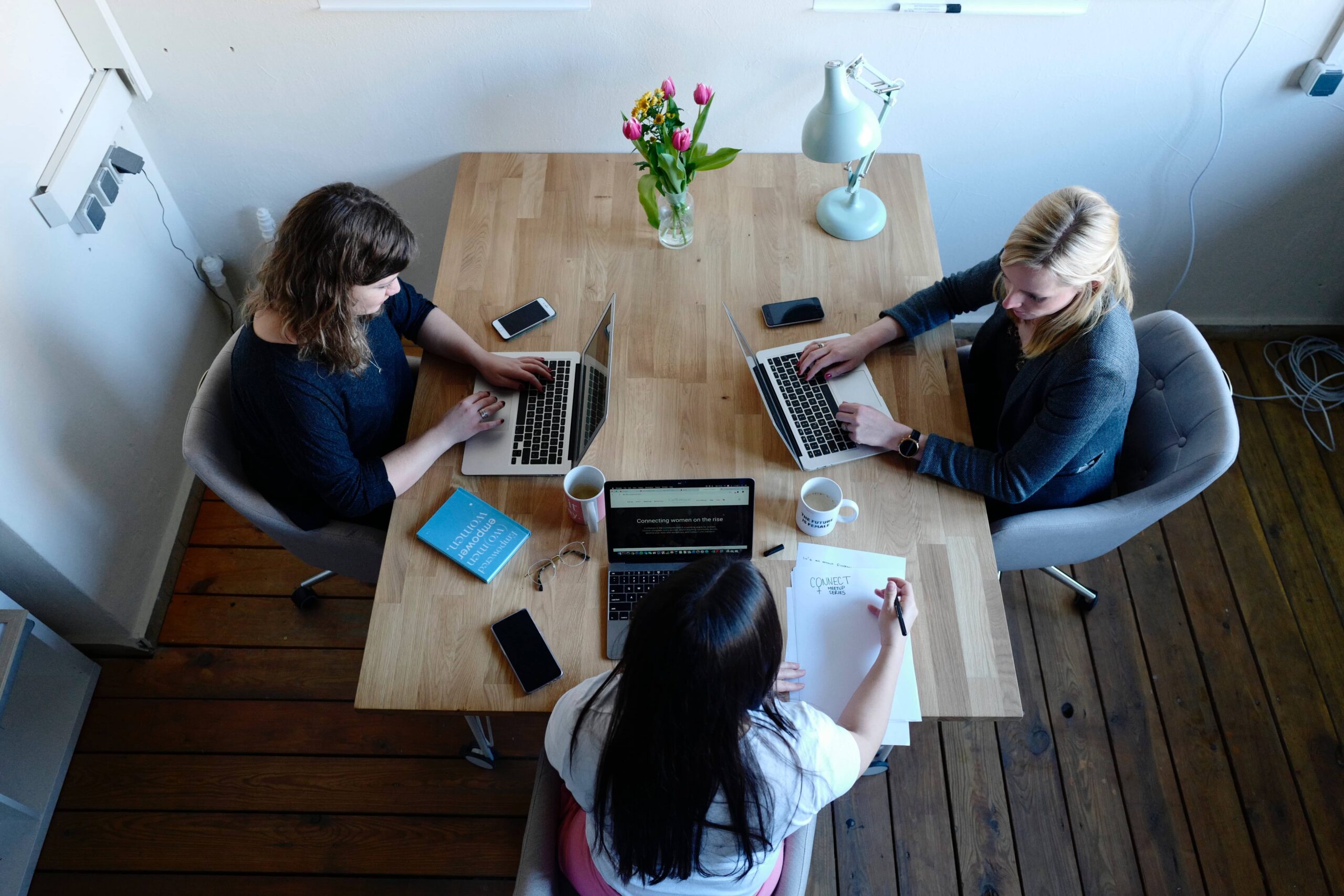 Breastfeeding mothers working together in office