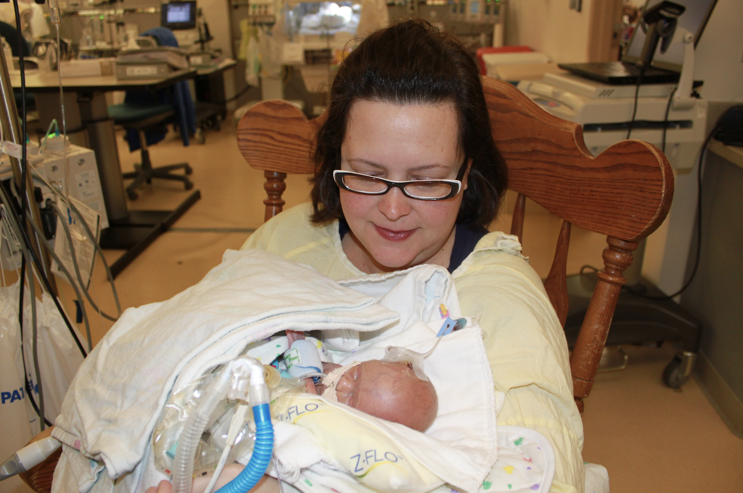 mom holding baby in hospital